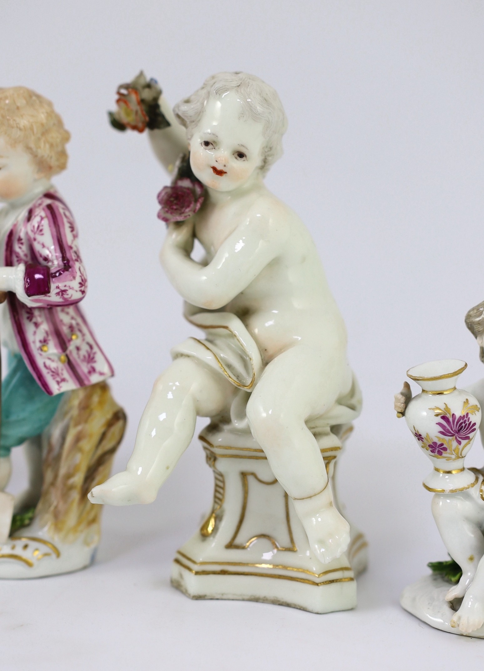Six Meissen porcelain figures of putti and a boy, second half 18th century, 8.5cm - 14.5cm high, restorations
